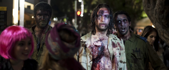 Israelis dressed as a zombies takes part in the customary 